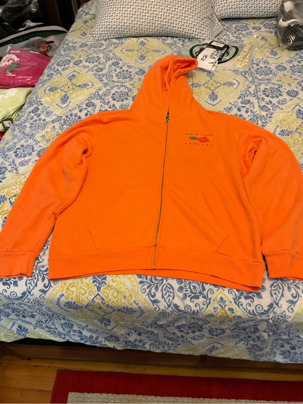 Denim Tears Bright Orange Full-Zip Hoodie Jacket with Subtle Chest Logo